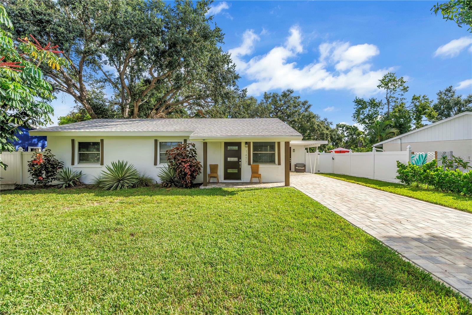 Welcome to this beautifully updated 3-bedroom, 1-bathroom residence in the highly desirable Arlington Park neighborhood. Offering no HOA and a spacious 1,100 sq. ft. paver driveway, there’s plenty of room for additional vehicles, recreational toys, or even a boat.
Step inside and you’ll find 1,297 sq. ft. of thoughtfully designed living space featuring porcelain tile flooring throughout. The modern European-inspired kitchen is equipped with custom cabinetry, granite countertops, and new stainless steel appliances, including a refrigerator and dishwasher. The bedrooms feature sleek sliding glass closet doors and provide ample storage, while the bathroom has been completely renovated with a tiled walk-in shower, a double vanity, and contemporary lighting.
A private side entrance leads into a versatile drop zone area, perfect for daily essentials or coats and bags. The laundry is tucked away behind a sliding barn door, and this space also offers the option to convert into a second bathroom if desired.
The fenced backyard is designed for outdoor living and relaxation, complete with a 200 sq. ft. paver patio, fresh sod, and a new irrigation system to keep the lawn lush year-round. The spacious lot also offers plenty of room to add a pool while maintaining privacy and open green space.
Recent updates include a new roof installed in 2018, a flat roof replacement in November 2023, thermal insulated windows, and storm shutters for added peace of mind.
Located within Sarasota city limits, this property is eligible for use as a vacation rental, making it an excellent opportunity for both homeowners and investors.
Residents of Arlington Park enjoy access to outstanding amenities, including lap and instructional pools, basketball and tennis courts, a playground, outdoor fitness gym, walking trails, and a dog park. All this, just three blocks from Sarasota Memorial Hospital and only minutes from Downtown Sarasota, Marie Selby Gardens, St. Armands Circle, Siesta Key, and Lido Key.