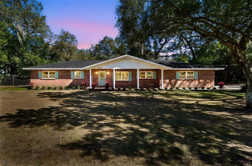 OVER 1 ACRE!!!!! Welcome home to this beautiful 3 bedroom 2 bath 2 car garage NON FLOOD ZONE Temple Terrace BLOCK CONSTRUCTION home! This is a super rare opportunity for a FULLY RENOVATED home on over an acre turn key ready to go. If you are looking for the perfect starter or family home, look no further. This home has been TOTALLY RENOVATED by the owner and includes upgrades perfectly fit for a first time home buyer or growing family. The totally remodeled kitchen features solid wood cabinets, granite countertops, NEW STAINLESS STEEL APPLIANCES, custom backsplash, and a designer faucet. The bathrooms features the same level of upgrades including custom vanity, granite countertops, designer tile, and new hardware. Other upgrades include, NEW IMPACT WINDOWS (2026), NEW AC (2026), NEW ROOF (2026), NEW WATER HEATER (2026), new flooring throughout, new paint, new LED light fixtures, and MORE!! HUGE BACK YARD on over 1 acre of land accompanied by a generously sized storage shed!!!  All of these amenities and upgrades are complimented by the unique curb appeal of the home which sits on a quiet street! This home has many desirable features and is a must see. Please call us or use ShowingTime to set up a showing today!