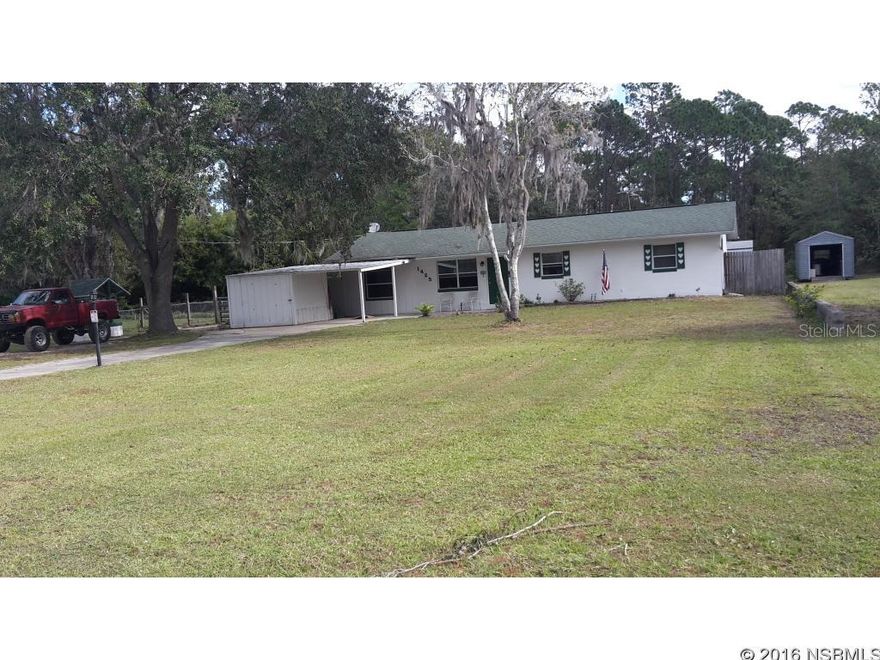 Under contract taking backups. Unique 4 bedroom 2 bath block home on one acre (+or-) near the schools/college on 10th street. Minutes to shopping center and 8 minutes to the ocean.New granite counters and granite topped island. Newly remodeled bathrooms. Huge screened porch and large laundry room. Sale includes hot tub. There are three sheds/work shops, one with AC. Part of this property is on a pond with a dock. Wising well on front lawn. Owner says that the neighbors are wonderful. Property is T-shaped. There is a well with a water softener and a septic tank. No water or sewer bill. Extra large 4th bedroom could be made into an in-law suite. It has its own entrance