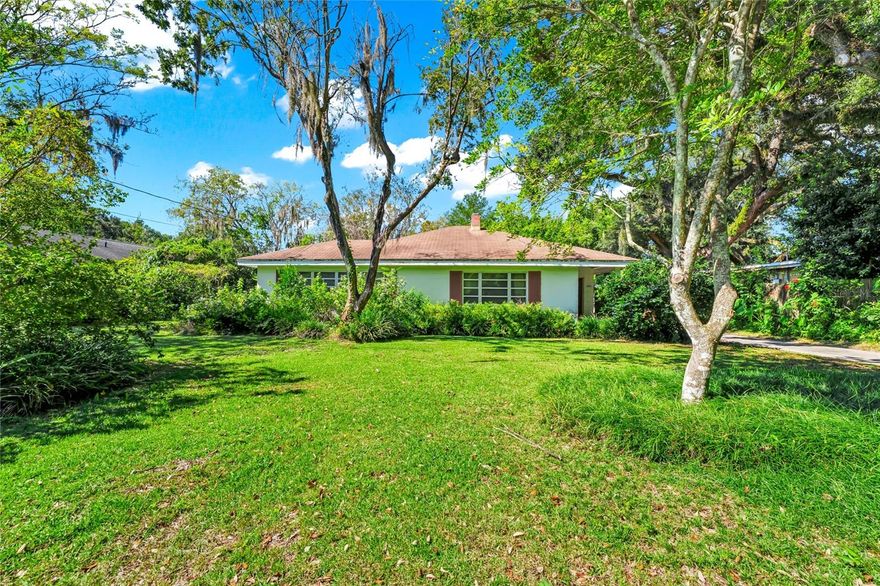 Some photos in the home were digitally staged. Very nice piece of property, .32 acres, located in a highly desired area of Orlando, between downtown Orlando and the Shoppes of Winter Park! There are many options available for this property depending on the what the owner wants to do... It has great promise as a remodeled and beautiful single family home, or based on the size of the property, the perfect spot for a new home, or even duplexes and/or multi family homes. Don't miss the opportunity to see the potential. This home was built by a special family and it served them very well, through the years. The home sits in the City limits of Orlando and is located on a quiet street in beautiful Central Florida. This property is quite unique. Three bedroom, two bath home with a living room, dining room and a large family room with a wood burning fireplace in the back. There is a two car garage with a garage door opener. Also in the back are two nice rooms that the owner added. One was a workshop where he cleaned and worked on clocks in addition to his full time work and another room used for crafts and storage. This home is a concrete home built on a slab and has plaster walls inside. There is no HOA and the A/C was new in 2022. The schools in the area include Audubon K-8 and the well known and excellent Edgewater High School. Both are great schools in the area. If you are interested in this location and see the potential to live here or purchase it and improve on what the property potential is...Put something in writing, if truly interested. It offers a great opportunity for the right buyer. Call and come take a look!