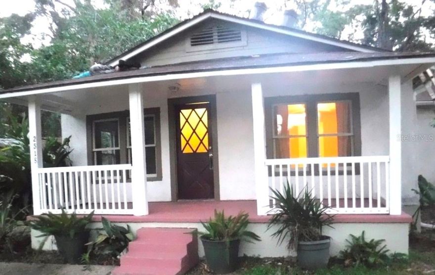 One or more photo(s) has been virtually staged. Charming 2-bedroom, 1-bath home offering a rare combination of historic character and future potential. Recent upgrades and thoughtful restoration complement the property’s original features. Recently permitted new electrical panel and system upgrades. Property has an additional uncleared rear lot that can be negotiated with the sale, offering significant development potential—buyer to verify zoning and allowable density. The home features original antique heart-pine hardwood floors, professionally refinished throughout, including the kitchen. The kitchen has been fully renovated and showcases lavender marble tile countertops and island. The movable island sits on lockable wheels, allowing flexible placement and secure positioning within the space. All original double-hung windows have been meticulously restored—fully disassembled, re-roped, and reconditioned—preserving the home’s historic character while ensuring proper function. Schedule your private showing to see this beautiful property.