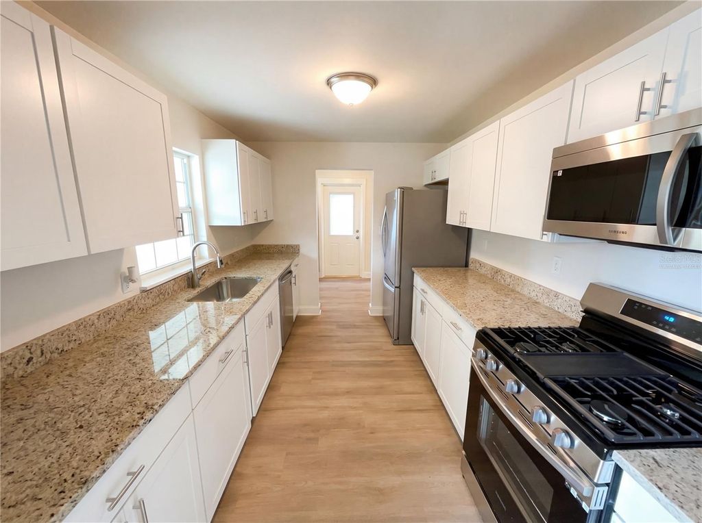 Photo of 7618 Brockbank Drive, Orlando, FL 32809 (MLS # O6377574)