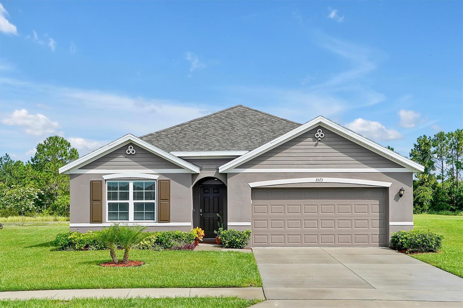 Outdoor adventure meets peaceful living in this beautifully maintained 4-bedroom, 2-bath Cali floor plan home in Mims, FL. Nestled in a quiet golf course community with no rear neighbors, the property backs up to open green space—offering extra privacy and room to build your dream patio or backyard retreat. Inside, enjoy an open-concept layout ideal for families, with a Jack & Jill bath between two bedrooms for added functionality. Tile flooring throughout the main living areas adds durability, while carpeted bedrooms provide comfort. The community features its own golf course, clubhouse, restaurant, and bar—perfect for relaxing or socializing close to home. Minutes from Mosquito Lagoon, Ind- River, and Playalinda Beach—great for kayaking, fishing, and rocket launches. Explore Merritt Island Wildlife Refuge, airboat rides, or skydive nearby. Close to shops, restaurants, the seafood markets, and 20 minutes to Space Coast Regional Airport. Schedule your appointment today!