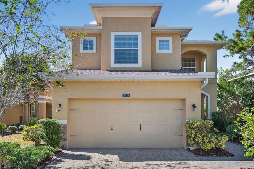 Welcome to Tuscany at Tampa Palms! Nestled within this beautiful gated community, you’ll find the perfect blend of privacy, convenience, and timeless design. This beautifully maintained two-story home sits on a serene pond lot near a quiet cul-de-sac, offering peace and tranquility just minutes from everything Tampa has to offer. Boasting 2,950 square feet and zero wasted space, this thoughtfully designed floor plan offers five spacious bedrooms, three and a half bathrooms, and a versatile loft—perfect for a home office, playroom, or secondary living space. Three of the bedrooms feature walk-in closets, and two share a convenient Jack and Jill bathroom, making it ideal for family living or guests. The luxurious primary suite is conveniently located on the main level and features elegant double tray ceilings, large windows that fill the room with natural light, dual walk-in closets, and a spa-like en suite bathroom designed for relaxation. At the heart of the home is the timeless kitchen, featuring rich brown cabinetry, granite countertops, and stainless steel appliances. A peninsula bar with seating and an adjacent dinette area provide plenty of space for both casual meals and entertaining. The inviting oversized living room showcases unique bamboo floors, while the upstairs loft features timeless hardwood flooring, adding warmth and character throughout the home. Enjoy Florida living at its finest with a screened-in lanai overlooking the peaceful pond and an extended paver patio, perfect for outdoor dining, entertaining, or simply unwinding at the end of the day. For those who love music or movie nights, the home also includes a built-in ceiling speaker system for a seamless audio experience. Additional features include a RainSoft water softener and treatment system, fresh interior paint, and low-maintenance living with HOA fees that cover lawn care, gated entry, and private road upkeep. Built in 2009, this home perfectly combines comfort, efficiency, and location. Tuscany at Tampa Palms offers the best of both worlds—tranquil living in a prime location with easy access to I-75, USF, Moffitt Cancer Center, top-rated hospitals, and premier shopping and dining destinations. Experience the charm, space, and convenience this incredible home has to offer—schedule your private tour today and for forget to ask about our **PREFERRED LENDER INCENTIVES** & **SELLER IS OFFERING A GENEROUS 10K CARPET CREDIT!**