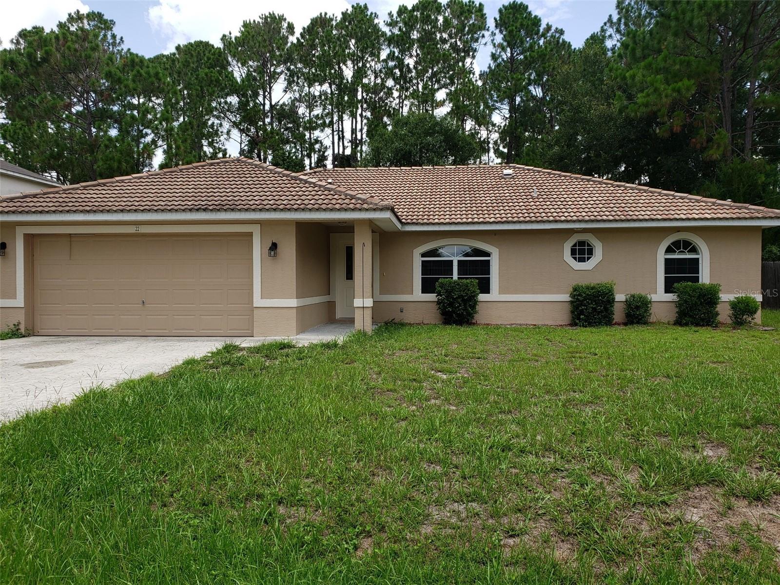 Fully renovated 4-bedroom, 2-bathroom home with a 2-car garage located in the desirable Pine Grove subdivision. The freshly painted interior, including walls, ceilings, doors, and trim, paired with modern LED lighting, creates a bright and inviting atmosphere. The brand-new kitchen features stylish cabinetry, a beautiful tile backsplash, granite countertops, and energy-efficient stainless steel appliances—making cooking a pleasure. The home offers a formal dining room adjacent to the kitchen and a separate living room. A spacious primary suite boasts an oversized walk-in closet. New plank-style tile flooring adds a modern touch and is easy to maintain. Ceiling fans in all bedrooms provide additional comfort. Enjoy the screened lanai overlooking a large, private backyard with mature shade trees. Conveniently located near walking and biking paths, schools, public pool, dining, shopping, hospital, and just minutes from the beach!