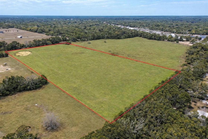 Rare opportunity to own 20 acres inside the city limits of High Springs, Florida, a unique blend of space, location, and future potential. Conveniently situated just off Hwy 441, this property offers quick access to town while still providing the privacy and flexibility of a large land holding.
The acreage is fully fenced and gated, with an agricultural exemption currently in place to help keep property taxes low. Zoned R-1 (residential), it presents the perfect setting for a private estate, homestead, or custom single-family home surrounded by room to roam, garden, and enjoy the natural beauty of North Florida. And with no HOA, buyers have the freedom to truly use the land to fit their vision, a major advantage for those seeking flexibility and fewer restrictions.
Beyond its immediate residential appeal, this property also offers tremendous long-term upside. Its location within city limits and proximity to major roadways make it a compelling candidate for future development potential (buyer to verify zoning, land use, and subdivision possibilities with the City of High Springs).
Whether you envision building your dream home, creating a family compound, holding as an investment, or exploring development opportunities, this 20-acre tract is truly a blank canvas in one of High Springs’ most desirable and growing areas.