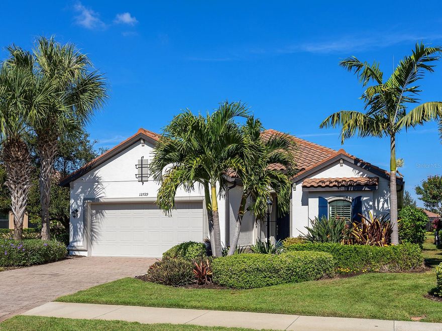 This beautifully upgraded Lazio-model home by Taylor Morrison is in the sought-after community of Esplanade Golf and Country Club in Lakewood Ranch, Florida. Built in 2014 and offered as non-golf bundled, this residence keeps HOA fees lower while allowing residents optional pay-to-play golf access. On a serene water-view lot, this three-bedroom, three-bath home showcases an open-concept floor plan filled with natural light. Large sliding glass doors and oversized windows with custom shutters frame picturesque views of the mature landscape and water. The gourmet kitchen has been updated with new quartz countertops, an oversized navy-accented island, and an extended café featuring a dry bar and wine refrigerator. Additional upgrades, totaling over $90,000, include new tile flooring throughout (no carpet), updated exterior paint and trim, and numerous interior enhancements. The great room seamlessly connects the family room, dining area and kitchen to the expansive lanai, your private outdoor oasis. Enjoy a heated saltwater pool and spa, along with a well-appointed outdoor kitchen complete with stainless grill, hood, bar refrigerator and sink. The private primary suite offers peaceful views and includes an en-suite bath with an oversized walk-in shower, dual-sink granite vanity and a large custom-designed walk-in closet. A second bedroom also features a private en-suite bath and built-in closet. The third bedroom showcases a beautiful, recessed alcove with window, ideal for a desk and is conveniently off the foyer, adjacent to the guest bath. Additional highlights include an oversized laundry room with abundant storage, laundry sink and newer washer/dryer, plus a 4-foot garage extension with overhead storage racks, ideal for larger vehicles or extra gear. This move-in-ready home blends luxury, comfort, and resort-style living in one of the area’s desired communities with amenities including a beach entry pool and spa, pool side dining at the Bahama Bar, state-of-the-art gym and exercise rooms, tennis and pickleball courts, golf, the Koquina Day Spa, a lifestyle director for community events, The Barrel House Restaurant and Bar, and more! The home is also within proximity to SRQ Airport, University Town Center Mall and shops, dining, Lakewood Ranch Medical Center, Main Street and Waterside shops and dining, Sarasota Polo Club, Lakewood Ranch Public Library and top-rated schools.