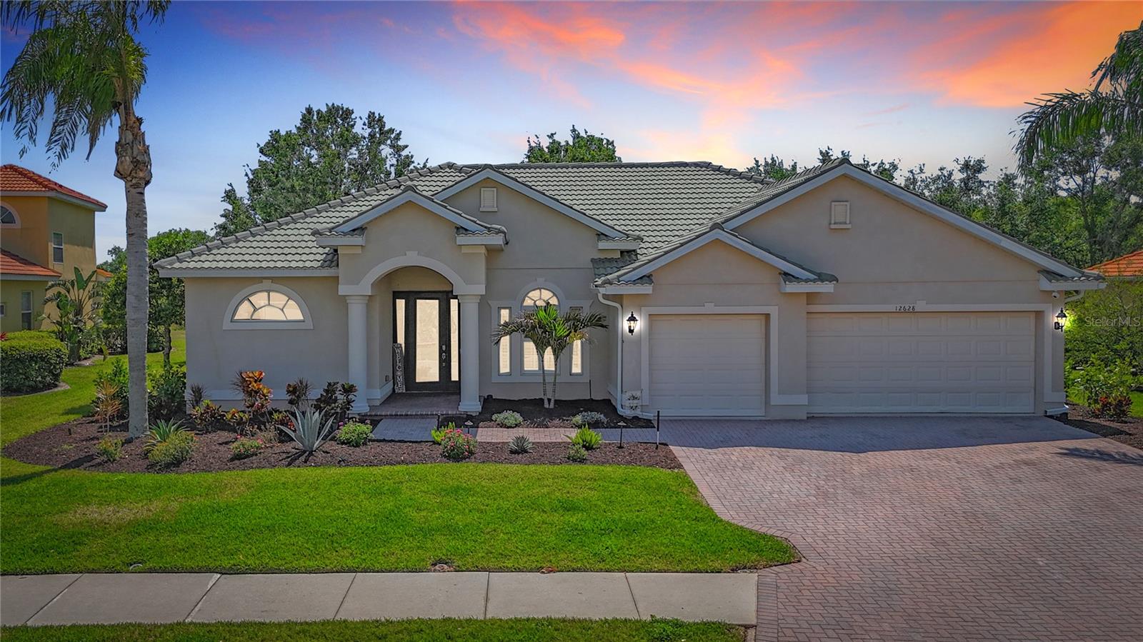 ***NEW PRICE REDUCTION!!!*** Discover luxury living at its finest in this stunning executive home nestled within the highly desirable Greyhawk Landing community!From the moment you arrive, you'll be captivated by the exceptional curb appeal, featuring a brick paver driveway, elegant landscape lighting and a striking decorative glass door. Spanning 2,500 square feet, this thoughfully designed split-bedroom floor plan boasts 3 bedrooms, 3 bathrooms a versatile den - perfect for a home office or easily convertible into a cozy live-in suite or multigenerational living. Step inside to find soaring double-tray ceilings adorned with crown molding, 5" baseboards and plantation shutters in the dining room, creating an atmosphere of timeless elegance. Step into a space transformed by a stunning accent wall, showcasing a breathtaking floor-to-ceiling statement piece paired with a sleek, modern electric fireplace, adding warmth and sophistication to the living area. The chef's kitchen is a true masterpiece, equipted with 42" cabinets, sleek granite countertops, stainless steel gas appliances including a new stainless steel dishwasher (2025), stainless steel refrigerator updated in 2025 and a charming breakfast nook with aquarium glass framing beautiful view of the private, preserve-backed lot. Extend your living space outdoors to the expansive 500 square-foot covered and screened lanai, where you can unwind while soaking in serene preserve and water views - frequently visited by deer and local wildlife. Sitting on generous third-acre lot, there's ample room to add your dream pool! When it's time to relax, retreat to the spacious owner's suite, complete with tranquil nature views, private lanai acces, two closets (one with custom shelving) and spa-inspired bathroom featuring dual sinks, a garden tub and a walk-in shower. This home is move-in ready with recent upgrades, including a brand-new HVAC system (2022), a tankless gas water heater (2023) and stylish LVP flooring throughout the main living areas (2023). Greyhawk Landing offers a resort-style lifestyle with gated security and amenities for all age: two community pools, a cluhouse, fitness center, tennis and pickleball courts, ball fields, a fishing pier and over 2 miles of scenic nature trails. Discover Greyhawk, nestled within the top-rated school districts of Sarasota and Manatee County, making in an ideal location for families seeking both luxury and educational excellence. Don't miss your chance to own this exceptional retreat - schedule your private tour today!