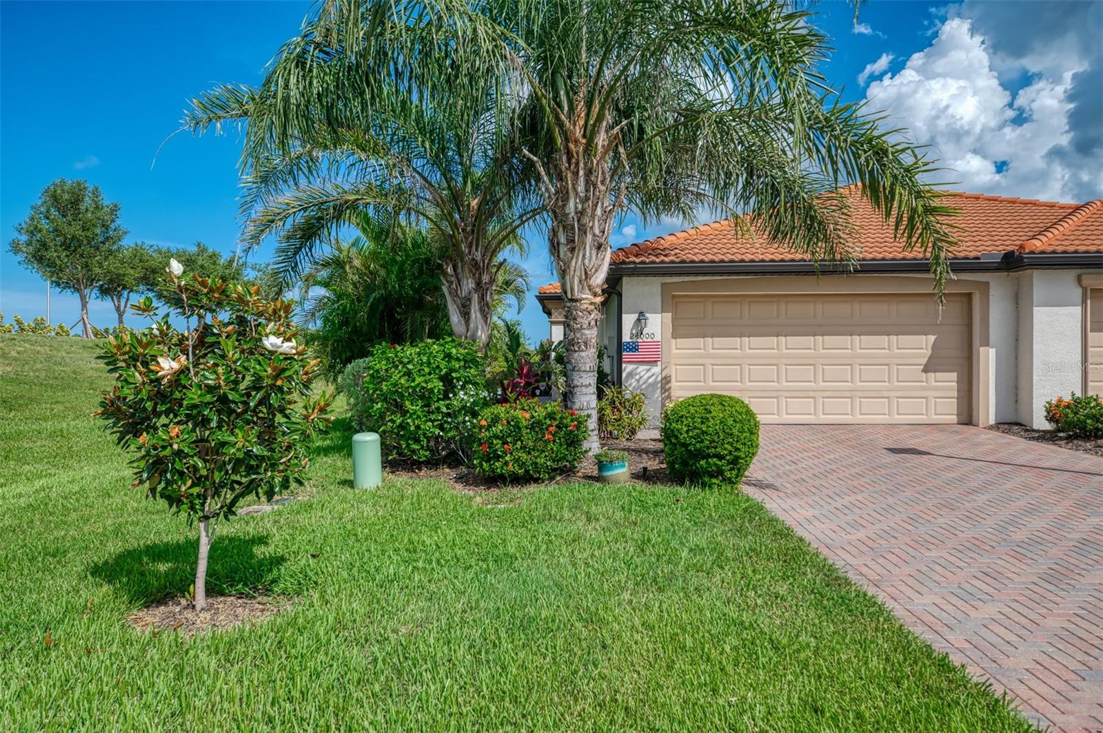 Dramatic price reduction on this gorgeous end unit villa located in the coveted community of Sarasota National where residents enjoy the generous spaces reserved for Florida wildlife through the partnership with the Audubon Sanctuary. The stage is set for this stunning home as you approach the beautifully landscaped and expanded walkway guiding you to the main entry. The villa offers 2 bedrooms, 2 baths plus a den/office allowing plenty of separation for entertaining guests. Decorative millwork, designer fans and lighting and a tasteful color pallet create an upgraded level of style and comfort. A Bosch dishwasher was added in 2022, a large Single Sink in the kitchen in 2025 as well as the pantry closet getting a makeover. Additionally there is a Rainsoft whole house water system and Airmaster ultraviolet whole house light. Built-ins were added to both bedroom closets. This house continues to please as you venture out back to your private oasis complete with a heated salt water spool and plenty of privacy with no neighbors on one side. The home features seamless underground gutters and a combination of motorized and accordion shutters for peace of mind should the need arise. This villa is located on the Lake Side of the community and is not impacted by golf side fees while still enjoying all the Resort style amenities Sarasota National is known for. Enjoy Tennis, Pickleball and bocce. Lounge by the pool, work out in the Fitness Center, dine Al Fresco by the Tiki Bar or enjoy the offerings in The Palm Club restaurant. There are NO minimums required. This is one to visit !