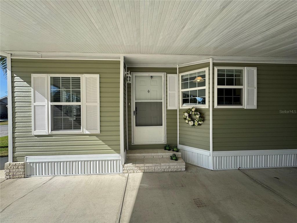 Photo of 6394 Lolly Bay Loop NE, Winter Haven, FL 33881 (MLS # L4958069)