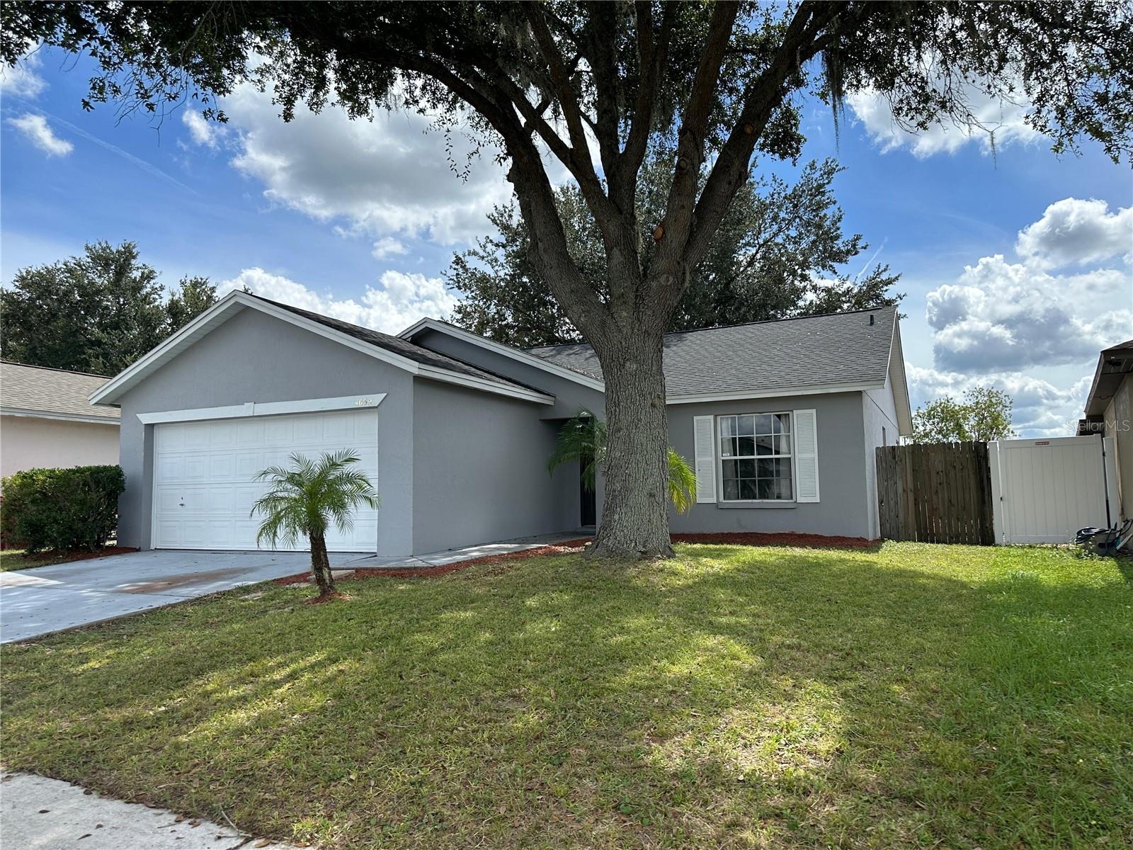 Take advantage of lower APR and make this house your home. This block home was renovated in 2022 with new roof, kitchen cabinets, spacious granite countertops, and still like-new appliances. The breakfast bar opens up to the big family room and overlooks the outside through double glass-doors. The cathedral ceilings span through most of the house making it feel spacious and modern. The dining room offers a private corner retreat for great dinner memories. Both restrooms were also renovated; one in the master bedroom and the second one located near the additional two bedrooms. Enjoy cookouts on your backyard with synthetic grass carpet so is easy to maintain clean. Newer electric boiler and matching semi-new washer and dryer are also included for your convenience.
Country Hills is an established community in Plant City located near I-4 for commuting to Tampa, Lakeland, or Orlando. The community offers sidewalks to walk your dog(s) or take the kids to the playground. If you are new to Plant City, welcome to the home of the Strawberry Festival. Enjoy community events downtown on the weekends or enjoy the country roads nearby. You are close to everything, welcome home.