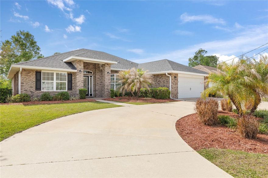 Welcome to your brand new dream home in beautiful Palm Coast. With NO HOA or CDD, this thoughtfully designed REAL BRICK Adams Homes 2265 floor plan offers the perfect blend of comfort, functionality, and modern style. Boasting 4 spacious bedrooms, 3 full bathrooms, and 2,265 square feet of living space, this home is ideal for anyone looking to enjoy Florida living at its finest. Picture a home that matches where you’re headed — more space, more comfort, and more room to live the life you’ve been planning. Step inside to discover an inviting layout with a seamless flow between the living, dining, and kitchen areas—perfect for entertaining or everyday living. Imagine having a kitchen built for real cooking and real gatherings… a backyard ready for weekend relaxation… or the room to finally gives your work-from-home setup the space it deserves. The modern kitchen features sleek granite countertops, a breakfast nook, and plenty of cabinet space, opening to a large family room that leads out to the backyard. The private owner’s suite offers a peaceful retreat with dual walk-in closets and en-suite bath featuring dual vanities, a garden tub for soaking, and a shower stall with glass door. Three additional bedrooms provide ample space for guests, a home office, or hobbies. Situated in the Pine Grove subdivision in Palm Coast, you’ll enjoy close proximity to local parks, beaches, shopping, dining, and schools. When you choose the right home at the right time, you gain more than square footage — you build equity, stability, and the freedom to enjoy each day more fully. Whether you’re looking for your first home, a forever home, or a vacation escape, this former Adams Homes model home is a must-see!  Step into a smarter investment and a home that feels like an upgrade to every aspect of your life. Take ownership of your future — and start loving where you live the moment you walk through the door. Schedule your showing today and experience Florida living in sunny Palm Coast, Florida!
