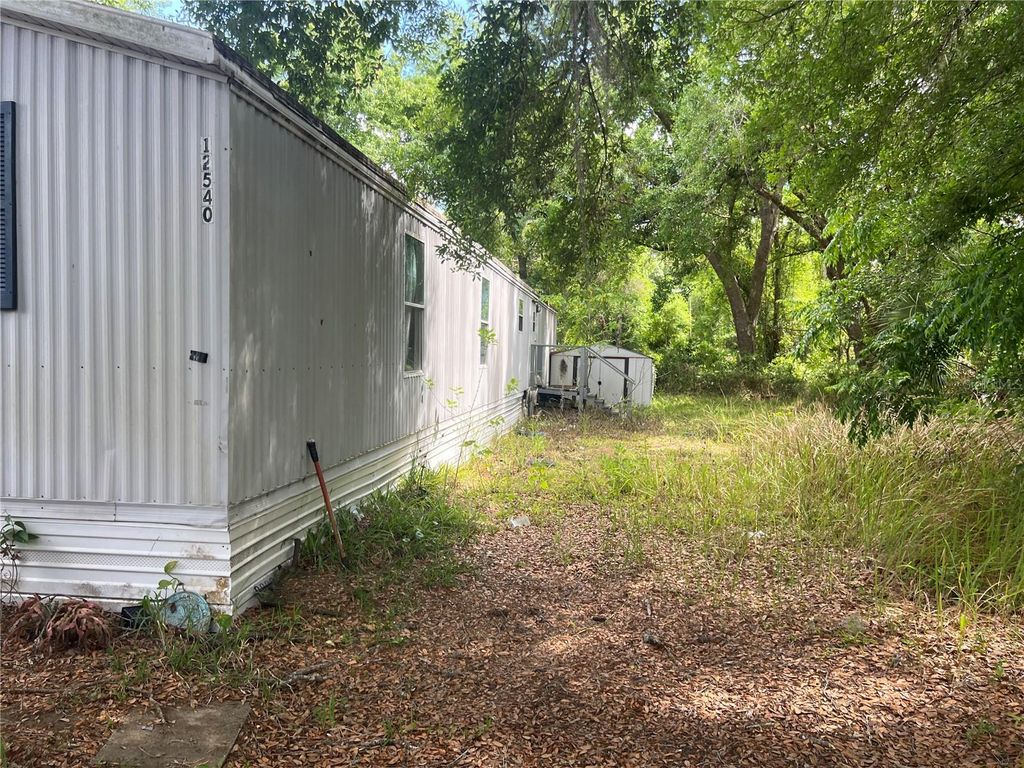 Photo of 12540 Gurnee Avenue, New Port Richey, FL 34654 (MLS # TB8498630)