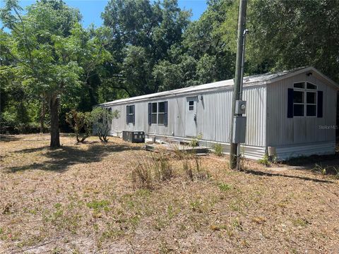 Photo of 12540 Gurnee Avenue, New Port Richey, FL 34654 (MLS # TB8498630)