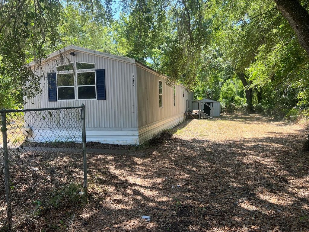 Photo of 12540 Gurnee Avenue, New Port Richey, FL 34654 (MLS # TB8498630)