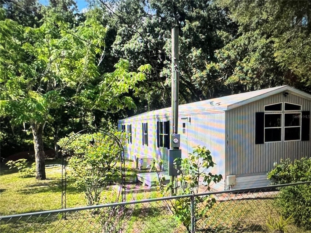 Photo of 12540 Gurnee Avenue, New Port Richey, FL 34654 (MLS # TB8498630)