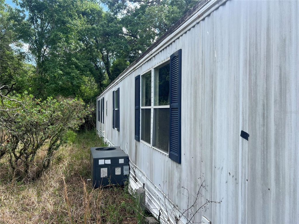 Photo of 12540 Gurnee Avenue, New Port Richey, FL 34654 (MLS # TB8498630)