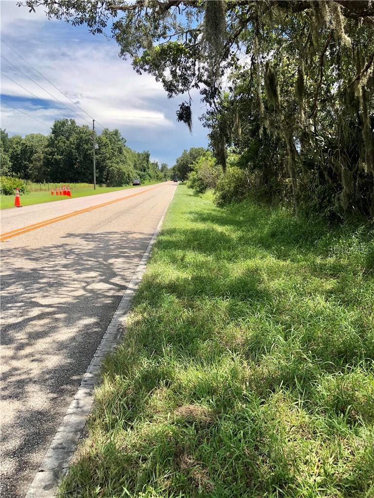 Very Exciting Hot Growth Area! Solid gold location on (545) Avalon Road! Only 2 miles from Walt Disney World properties! High Traffic Counts! Other similar size lots in the area have been rezoned successfully through Orange County Planning & Zoning for Multi-family use. This lot, per tax roll, is 11.5 acres giving you a solid 2 acres of upland to build on (Ask about a concept for a high rise condo building plan already drafted) and 9.5 acres of beautiful Lake Oliver which could be perfect for a boardwalk lining the shore, a restaurant, shops, a community pool and a large condo building (depending on the investors budget and Orange County rezoning approval how many units and how high) the investor could do. Upon request, a sketch drawing of this concept is available. There is about 667 ft of Avalon Road (545) frontage with an estimated 7,000 cars per day, which could be perfect for commercial mix use and multifamily condo units for the front portion of this lot, if rezoned. Please reach out for an unbranded property presentation and approved application process for rezoning. Let's explore the highest and best use for this property with your investor’s vision! It's only 1.3 miles up from Highway 192 (60,000 cars per day) on Avalon Road in Winter Garden from the main center of all the Disney World attractions and vacation/residential districts. Main roads: 545, 192, 429, I-4, and 27! Recent and current developments by major/national builders in the immediate area include some of the following projects but not limited to: The Grove Orlando Resort has 878 Condo/Hotel Units, Palisades Orlando Resort - 890 Condo units, Orange Lake has 3,400 timeshare units and golf course, Storey Lake has over 300-400 homes and townhomes near by, Encore at Ovation has their first phase of 140 homes going up off Fleming, The Grand At Westside has 336 units, Flamingo Crossing with 3 hotels going up and shopping/restaurants, Horizons West community thousands of homes and new shopping centers, Disney Springs and all the Disney World resorts and properties. Many restaurants, and shopping in the area! Opportunity is here for the right investor either local or global! Perfect, if you wish to buy and hold! Buyer must confirm all information regarding the property during their due diligence period. All information provided here is to be provided as estimates, and as a part of ongoing research investigating the best and highest use for this property in combination with the current and surrounding areas. There is a mobile home on the property with water and electricity but we are selling the property as vacant land. Owner occupied. Please do not go to the site without the listing agent. 2 parcels being sold together.