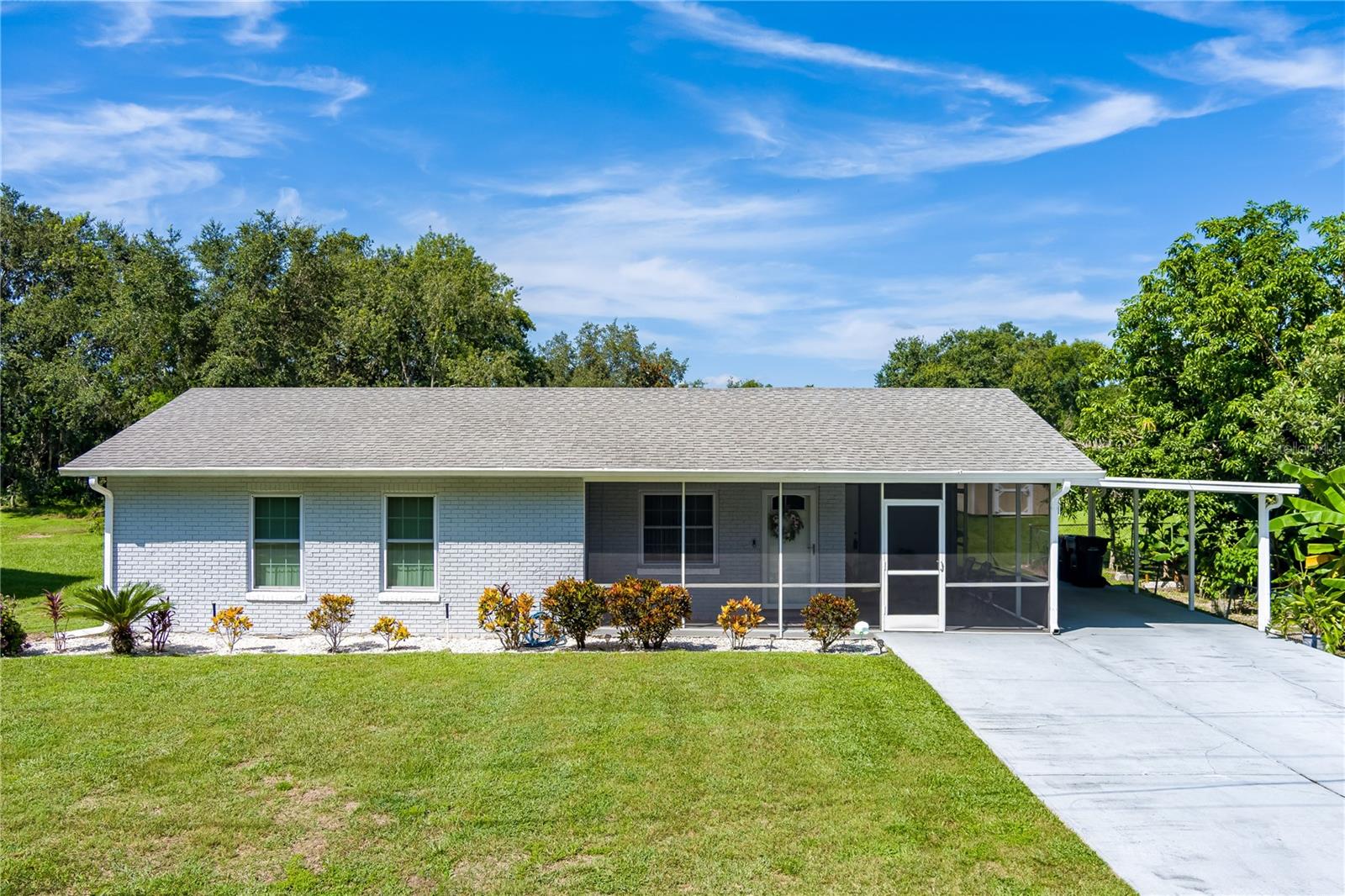 Welcome to this well-maintained 3-bedroom, 1.5-bath home situated on a .27-acre lot with no CDD and no HOA! Enjoy peace of mind with all new windows and doors, new storm doors, a new A/C unit (2021), new gutters (2024), new appliances, ceiling fans, and wood flooring throughout. The home features a screened-in side porch, perfect for relaxing, and a utility shed for extra storage. The lush landscaping adds curb appeal and privacy. This charming home is move-in ready and offers comfort, freedom, and functionality—inside and out. This property is USDA eligible and qualifies for no money down!!!