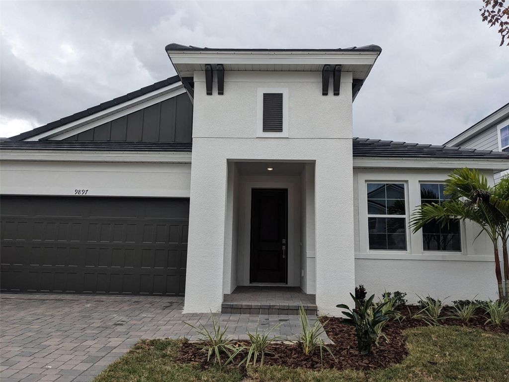 Photo of 9897 Surrey Rose Drive, San Antonio, FL 33576 (MLS # J995427)