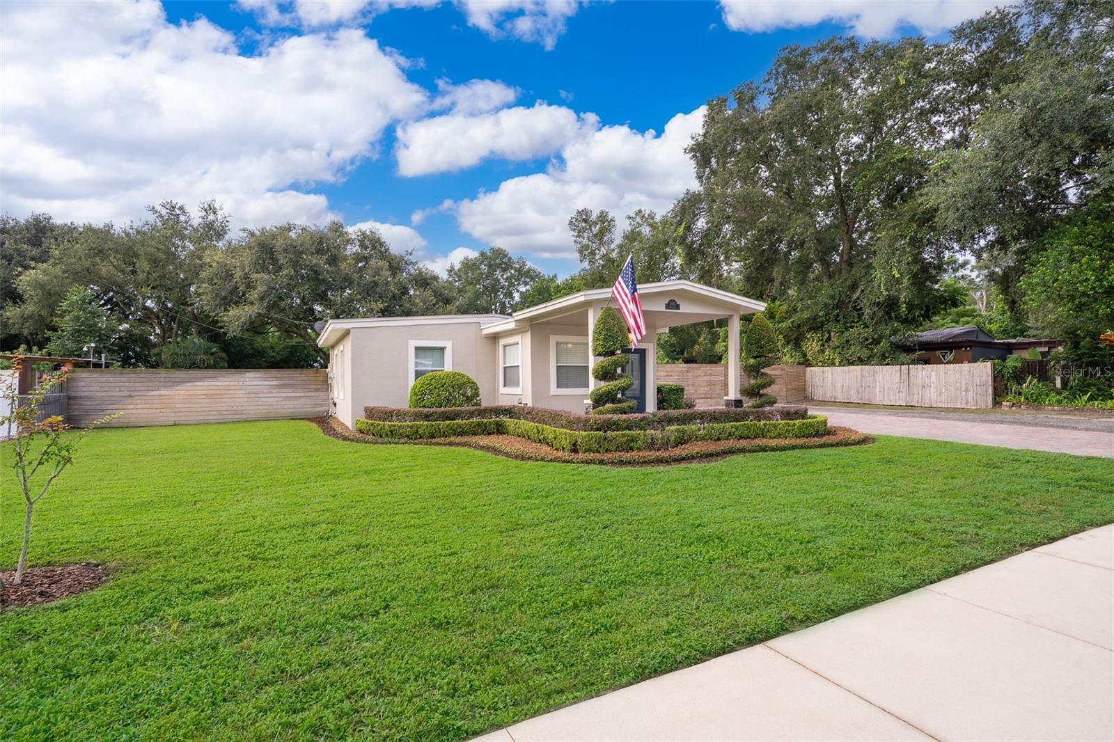 MOVE IN READY - NO HOA - OVERSIZED LOT .52 - METAL BUILDING 35' X 20' WITH ELECTRIC & WATER - GAZEBO WITH T.V. HOOKUP, ELECTRIC AND WATER - PRIVACY FENCED BACKYARD - PROFESSIONALLY LANDSCAPED - FULL IRRIGATION - PAVER DRIVEWAY. Beautiful Bungalow - 2 Bedrooms 1 Full Bathroom Home - Tile and Laminate Flooring Throughout - Updated Kitchen with Stainless Steel Appliances, Granite Countertops and Stone Backsplash - Indoor Laundry Room Washer/Dryer Included - Spacious Covered Front Porch - Screened Back Porch off Dining Room - Private Backyard with Cozy Outdoor Gazebo with Pavers, T.V. Hookup and Open Fire Pit - Perfect For Entertaining Family and Friends! Conveniently Located - Easy Access to Major Highways, Restaurants, Shopping and the University of Central Florida. Close to Disney World, Universal Studios, Sea World and Everything Central Florida Has to Enjoy! Short 1 Hour Drive to Some of Florida's Most Beautiful Beaches! Call Today for a Private Showing!!