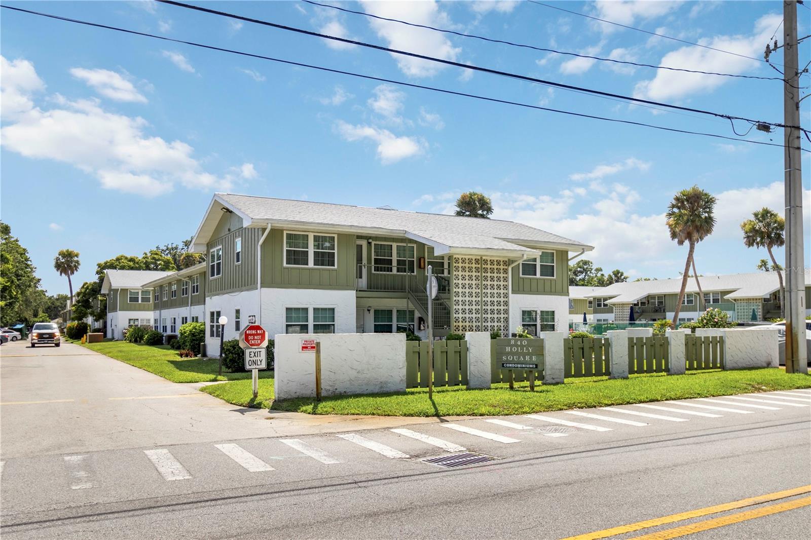 Available NOW! $0 Application Fee for Pre-Approved Applicants. Discover modern living in this beautifully updated 2-bedroom, 1-bathroom second-floor condo nestled in a peaceful, park-like setting. Just minutes from the beach, river, Daytona International Speedway, and Tanger Outlets, this home combines comfort and convenience. Step inside to brand-new flooring, fresh paint, and upgraded lighting and ceiling fans throughout. The kitchen shines with soft-close cabinets, granite countertops, and sleek stainless steel appliances. Enjoy generously sized bedrooms with ample closet space and a fully updated bathroom designed for everyday ease. Holly Square Condos is located on the mainland in Holly Hill, a city within Volusia County. It is a quiet community offering a relaxed setting and is centrally located near shops and transportation lines. Community perks include a sparkling pool, clubhouse, and tennis courts. HOA approval is required. INQUIRE NOW!