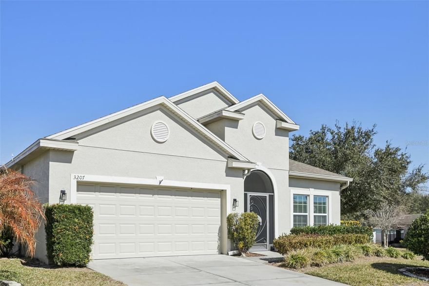 Located in the heart of Grand Island, this well-maintained 4-bedroom, 2-bath single-story home offers the OPEN LAYOUT, OUTDOOR LIVING SPACE, and energy-efficient features you have been searching for – just one block from the community pool, playground, and basketball court! Major updates include a ***NEW WATER HEATER (2023) and ASSUMABLE SOLAR PANELS*** that help keep energy costs low, adding long-term value and efficiency. Set on a generous ***.23 ACRE / CORNER LOT***, this property also offers easy entry and exit within the community and is ideally positioned near the amenities and walking trails residents love. Inside, the open concept floor plan connects the great room, dining area, and kitchen in one continuous, light-filled layout – perfect for everyday living and entertaining. TILE FLOORS throughout enhance the clean, cohesive feel while offering LOW MAINTENANCE durability. The kitchen is thoughtfully designed with granite countertops, STAINLESS STEEL APPLIANCES, a large center ISLAND, 42” MAPLE CABINETRY, pantry storage, a window over the sink, and a blend of pendant and recessed lighting – creating a bright and functional space for cooking and gathering. SPLIT BEDROOMS deliver added privacy, with the generous PRIMARY SUITE tucked away at the back of the home. Your peaceful retreat features a large WALK-IN CLOSET and a well-appointed en-suite bath, offering comfort and separation from the secondary bedrooms. Step outside to one of this home’s standout features – an OVERSIZED COVERED & SCREENED LANAI with extended patio space, creating an incredible outdoor living area suitable for living, dining, or hosting gatherings year-round. Whether you are enjoying a quiet morning coffee or entertaining friends, this space truly extends your living area outdoors. Residents of Eustis Grand Island Reserve enjoy a well-kept community with amenities including a COMMUNITY POOL, playground, basketball court, and scenic walking trails – all just moments from your front door. Conveniently located near shopping, dining, and major roadways like the 44 and 19, this home delivers the perfect balance of comfort, community, and accessibility. Light, bright, fresh, and ready for you to make it your own – this Grand Island gem checks all the boxes. Call today to schedule a tour!