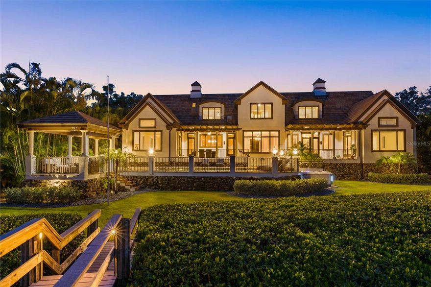 Private Island, Gated Home, Private access to deeded beach!

Experience the epitome of exclusivity with unheard of waterfront views, unmatched privacy, and breathtaking, expansive vistas from your own private island retreat. Tucked away on a private island in Siesta Key’s South Cocoanut Bayou, this Tuscan-inspired estate feels like it’s been plucked from the pages of a storybook.  The estate at 4315 Mangrove Place features a Tuscan-inspired central courtyard with over 4000 sq ft designed as the heart of the home. It is a grand, open-air courtyard enclosed by both the main residence and the guest villa, connected via an elegant, covered breezeway.
The main residence offers soaring ceilings, intricate millwork, and expansive living spaces ideal for entertaining or quiet coastal living. A gourmet chef’s kitchen, formal dining room, library, owner ensuite located on the main level with his & hers walking closets and bathrooms, and custom home theater create a balanced blend of function and indulgence, Elevator in main residence & private elevator in guest house.
Connected by a covered breezeway, the guest villa features its own living quarters, private elevator, one bedroom, full bathroom, living room and full kitchen—perfect for multigenerational living or extended guests. 
With six bedrooms, nine baths, a three-car garage, and an ambiance that feels like a timeless escape, this estate is more than a home—it's a legacy, a retreat, a living Castle fairytale.
Outdoors, a resort-style pool and spa, and lush tropical landscaping create a serene oasis, while a private deep-water dock provides direct access to the Intracoastal and Gulf with no fixed bridges. Eligible to membership to private beach.