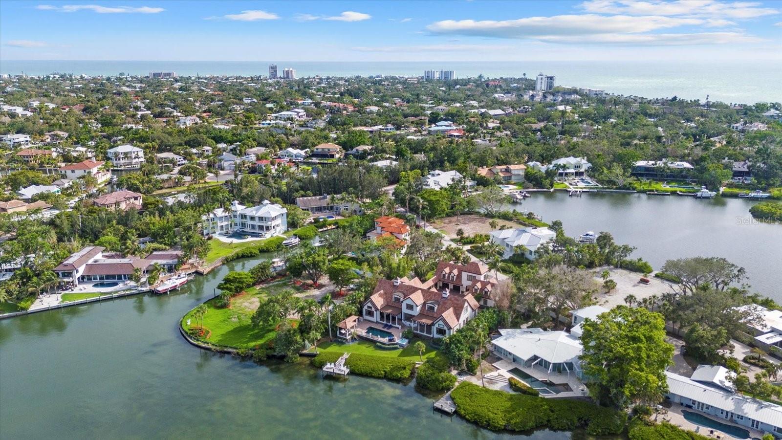 Experience the epitome of exclusivity with unheard of waterfront views, unmatched privacy, and breathtaking, expensive vistas from your own private island retreat. Tucked away on a private island in Siesta Key’s South Cocoanut Bayou, this Tuscan-inspired estate feels like it’s been plucked from the pages of a storybook. The estate at 4315 Mangrove Place features a Tuscan-inspired central courtyard with over 4000 sq ft designed as the heart of the home. It is a grand, open-air courtyard enclosed by both the main residence and the guest villa, connected via an elegant, covered breezeway.
The main residence offers soaring ceilings, intricate millwork, and expansive living spaces ideal for entertaining or quiet coastal living. A gourmet chef’s kitchen, formal dining room, library, owner ensuite located on the main level with his & hers walking closets and bathrooms, and custom home theater create a balanced blend of function and indulgence, Elevator in main residence & private elevator in guest house.
Connected by a covered breezeway, the guest villa features its own living quarters, private elevator, one bedroom, full bathroom, living room and full kitchen—perfect for multigenerational living or extended guests.
With six bedrooms, nine baths, a three-car garage, and an ambiance that feels like a timeless escape, this estate is more than a home—it's a legacy, a retreat, a living Castle fairytale.
Outdoors, a resort-style pool and spa, and lush tropical landscaping create a serene oasis, while a private deep-water dock provides direct access to the Intracoastal and Gulf with no fixed bridges. Eligible to membership to private beach.