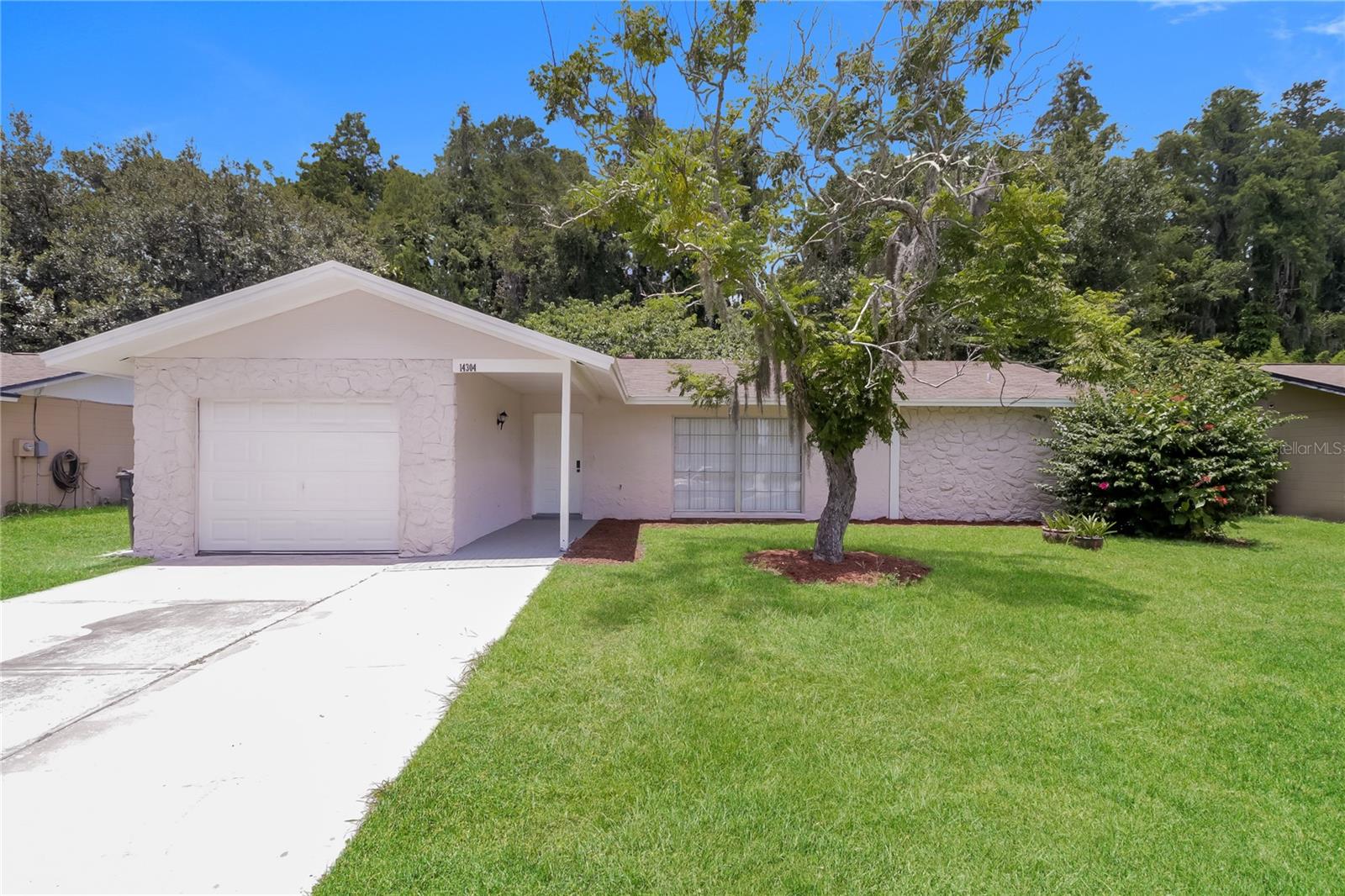 One or more photo(s) has been virtually staged. Welcome to the lovely community of Carrollwood Meadows in Tampa, Fl! This beautiful home nestles on great sized lot with 3 bedrooms, two full baths, garage an enclosed lanai with updated tile and tile & laminate flooring. The kitchen features newer cabinets, HD lighting, stainless steel appliance set that is open concept to the living room. the roof is 2024. The community has NO HOA or CDD and conveniently located near the Veterans Expressway, 5 minutes from Citrus Park Mall, surrounded by plenty of restaurants and shopping plazas. Live the Florida lifestyle within 15 minutes of Ben T. Davis Beach and the Causeway Boat Ramp.