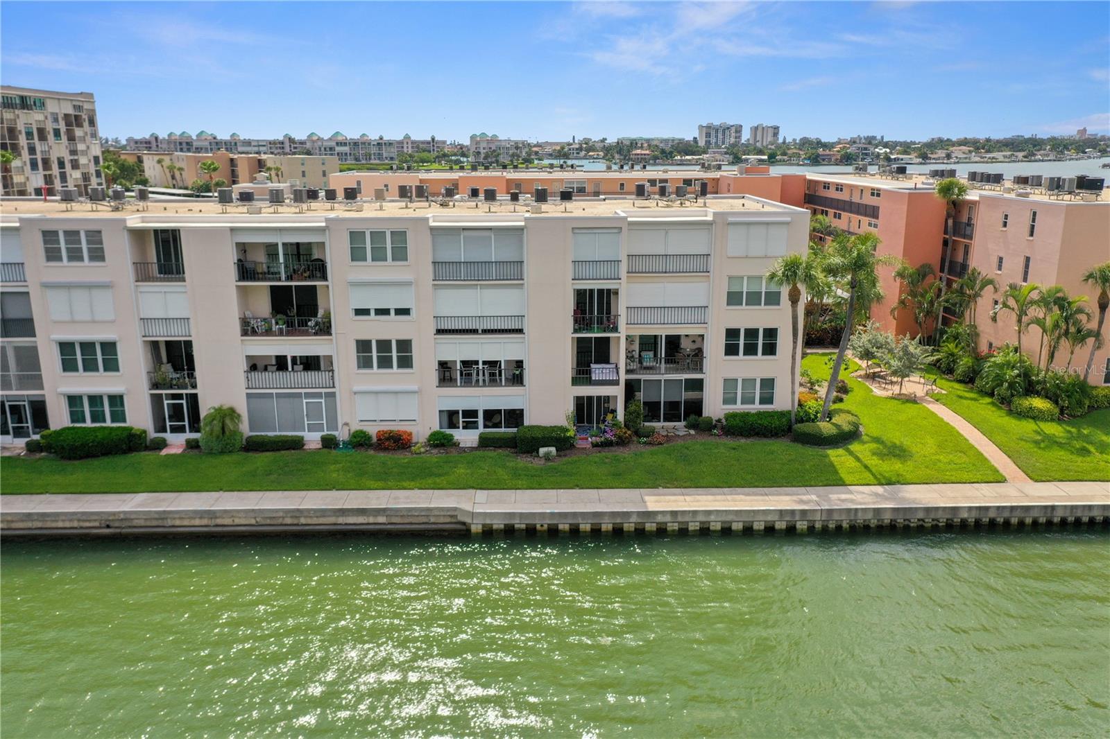 AVAILABLE starting AUGUST 1, 2025. FULLY FURNISHED, TURNKEY CONDO ON THE WATER located in the popular gated, active 55+ community of Bay Island just minutes to St. Pete Beach. Short term leases available at $2,000/month and seasonal (Jan-Apr) at $3,0000/month. Unit has been updated with tile throughout, newer hot water heater and a/c and a beautiful remodeled bathroom with walk-in shower. Bedroom is spacious enough to accommodate a king size bed and features a large walk-in closet and access to a private balcony with expansive water views to watch the boats, wildlife and dolphins playing in the Bay Island Cove & Boca Ciega Bay. Enjoy living in your beach oasis in a 24-hour guard gated community with 6 pools, spas, tennis courts, boat docks on a first come first serve, recreational facilities, his and hers gyms, library, card room, waterfront Tiki huts and grilling area, billiards and more. Community is across the bridge from St. Pete Beach shops, boutiques, restaurants, and Corey Avenue market. About 20 minutes to downtown St. Petersburg and 45 minutes to Tampa International Airport.