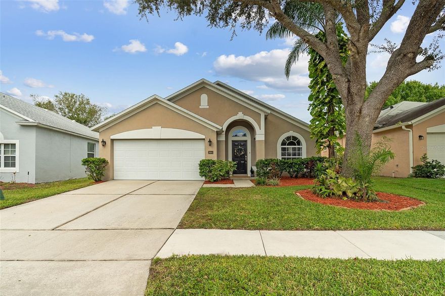Welcome to Andover Cay! This home features a NEW ROOF (2022), NEW A/C SYSTEM (2022), and modern wood-look TILE FLOORING throughout main living areas! Step inside and you’ll instantly notice the TALL VAULTED CEILINGS and an open, airy feel. This 3 bedroom home is SPACIOUS with 2 LIVING ROOMS! There’s also a BREAKFAST NOOK, and COVERED SCREENED BACK PATIO that has a WATER VIEW — perfect for entertaining or staying connected during family time. Enjoy morning coffee or evening sunsets over the LAKE, with plenty of room for gatherings and weekend BBQs. The PRIMARY SUITE offers soft carpet, CEILING FAN, NATURAL LIGHT through the double windows, and a bonus SLIDING GLASS DOOR for direct patio access. The ENSUITE PRIMARY BATHROOM features NEW SINKS AND FAUCETS, a GARDEN TUB, WALK-IN SHOWER, NEW TOILET, and a WALK-IN CLOSET. Two additional bedrooms share a bathroom that has been updated in recent years with a new vanity sink. The 3rd BEDROOM IS HUGE! The neighborhood comes with amenities including a COMMUNITY POOL, SAND VOLLEYBALL COURT, and TWO PLAYGROUNDS. It’s located close to highways 417 and 408, Waterford Lakes Town Center, UCF, and just 20 minutes from the Orlando International Airport. Conveniently, take over the leased SOLAR PANELS to continue average savings of 22% per year on electricity bill! WATCH VIRTUAL / VIDEO TOUR to see more of the house!