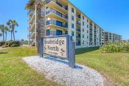 Enjoy breathtaking ocean views from your private balcony and take a short walk across A1A to the no-drive beach via a convenient boardwalk directly across from the condo. Located in Seabridge North the quaint complex features 67 units between both 5 story buildings. This property offers convenience of an elevator! No walking groceries upstairs! The unit also features a new AC unit, a spacious layout with modern appliances, in-unit laundry, and elegant tile flooring. The community includes a sparkling in-ground pool.