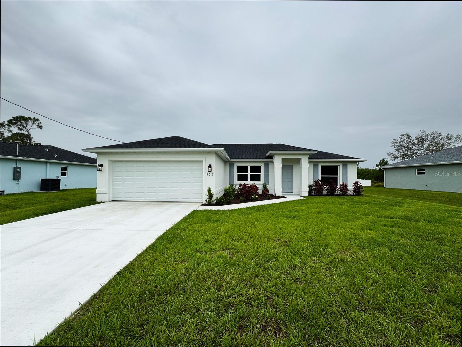 One or more photo(s) has been virtually staged. Beautiful New Construction Home Available Now! Everything is Included and Everything is Upgraded! Starting with an open, split floor plan with vaulted ceilings, this home has Hurricane Impact, insulated, low e windows, full overlay cabinets, stainless steel kitchen appliances, quality stone countertops and window sills, porcelain tile throughout, 30-year shingles, 3 zone sprinkler system, screened lanai, brand name plumbing and electrical fixtures, fully sodded and landscaped. This home has been built to keep insurance, maintenance and utility costs low. Preferred lender is offering up to $1,500 in closing cost assistance! Take a tour through of one of our Beautiful Homes: https://youtu.be/SFsL-Aell24