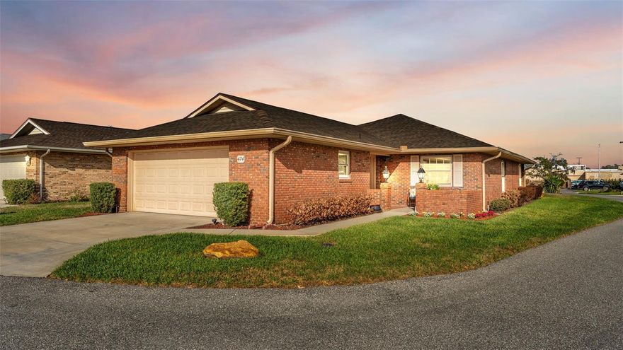 With over $100K in upgrades and improvements, this 2BR/2BA home is situated on a large corner lot in the highly sought after lakefront community of Villas by the Lake.  As you approach the front door, you will be greeted by a beautiful outdoor sitting area.  Upon entry, the large foyer will lead you to an open concept living/dining room, perfect for family and entertaining.  The adjacent den has a closet and would make a great 3rd bedroom.  The upgraded kitchen is a chef's delight and features Corian countertops, "soft-close" cabinets, and stainless-steel appliances.  Under cabinet lighting enhances kitchen functionality and ambiance.  The split bedroom design provides extra privacy with the primary bedroom and bath located on the back of the home.  And the beatufilly tiled, screened lanai is an additional bonus providing a space to enjoy your morning coffee or to extend your outdoor entertainment.  Other amenities/upgrades include:  2 car garage with a hurricane door (the washer and dryer in the garage both convey), upgraded tile flooring in the kitchen and main living areas, updated kitchen and bathrooms, and a new roof, 2025.  The ac is 2016 and has recently been serviced to ensure continued functionality.  Enjoy the additional amenities provided by the Villas by the Lake community including a lakefront clubhouse, community pool, fitness center, shuffleboard courts, tennis and pickleball courts, and a community boat ramp providing access to Kelly Lake.  The HOA fee also includes cable/internet through Spectrum and lawn maintenance.  Located in close proximity to medical facilities, shopping, dining and easy access to I-4, this is truly Florida living at its best.