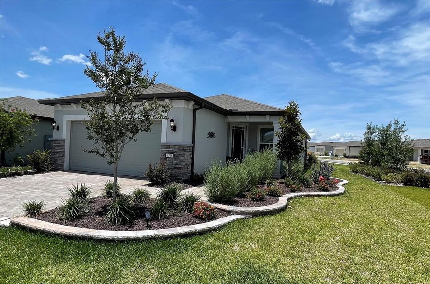 Welcome to this beautifully upgraded Mystique model located in the highly desirable Bridlewood neighborhood of Del Webb Stone Creek. Situated on a professionally landscaped corner lot, this exceptional home offers stunning curb appeal with a paver driveway and entrance, elegant architectural details, upgraded baseboard moldings, and custom trim work throughout. Thoughtfully designed and meticulously maintained, this residence blends luxury, comfort, and resort-style living in one of Ocala’s premier 55+ communities.

Inside, the open-concept floor plan is filled with natural light and designed for both everyday living and entertaining. The gourmet kitchen features upgraded cabinetry, quartz countertops, pullout drawers, a large center island, and custom pantry built-ins that maximize storage and functionality. The spacious living and dining areas flow seamlessly together, while the flexible layout provides additional space ideal for a home office, hobby room, or guest accommodations.

The owner’s suite offers a peaceful retreat with custom master closet built-ins and a beautifully appointed en-suite bath. Step outside to enjoy the expanded screened lanai complete with drop-shades for added comfort and privacy, all overlooking your private backyard oasis featuring a 15x10 swim spa. Additional upgrades include an epoxy-coated garage floor and numerous high-end finishes throughout the home.

Residents of Del Webb Stone Creek enjoy access to world-class amenities including resort-style indoor and outdoor pools, fitness center, pickleball and tennis courts, golf, walking and biking trails, dining, and countless clubs and social activities. Conveniently located near shopping, restaurants, medical facilities, and entertainment, this exceptional Mystique model offers the perfect opportunity to enjoy luxury living and an active Florida lifestyle.
More photos to come.