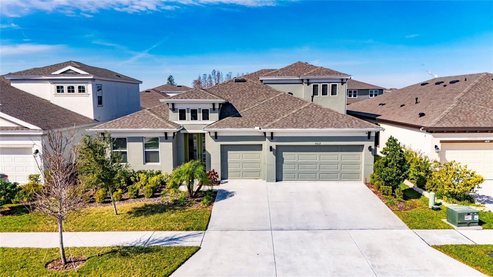 This NEARLY NEW immaculate Westbay- Bayshore 2 is one of the most desired floorplans in the Resort Style community of Waterset! This home is situated on a quiet street yet very close to all the resort style amenities!
The Bayshore 2 is nearly 3,300 Sq Ft of very well thought out space! Boasting 5 bedrooms (4 on the main floor), 4 full bathrooms (3 on the main floor) and 3 car garage!
Pulling up to this home you will notice the chosen exterior elevation really stands out!
Upon entry the lush landscape and beautiful glass pane 8ft double doors are fun and eye catching!
The oversized foyer and soaring 12ft ceilings make for such a grand entry.
Your eyes will be quickly drawn to the main living area, massive 8ft sliders with a picture perfect view of the lanai and outdoor living/ kitchen area!
This open concept floor plan is an entertainers dream with plenty of space to stretch out with guests or lounge with loved ones! This "smart" home also has built-in indoor and outdoor surround sound that will elevate your listening experience for any occasion!
The chef's kitchen is equipped with all upgraded GE Profile appliances! wall mounted oven and microwave, natural gas cooktop, vented hood and double door refrigerator! Seamless double thickness quartz countertops, elegant espresso cabinetry, all matching throughout the home! Also note the additional cabinets in the island and pot drawers!
The indoor/ outdoor living is top tier in this home! The beautiful outdoor kitchen is such a wonderful added bonus overlooking a spacious backyard with scenic palm tree views! Boasting a commercial sized grill, vented hood, sink and refrigerator and mounted TV! This space is sure to be a griller's playground! The screened in lanai will ensure you can enjoy cooking, dining and relaxing all year around!
The first floor primary bedroom is so spacious, full of natural light, great sized closets and a beautiful en-suite bathroom!
The first floor laundry room has been fully upgraded with tons of cabinetry, open shelving, beautiful countertops and utility sink, making laundry time a breeze!
The split floor plan on the first floor - 4 bedrooms and 3 bathrooms are well situated throughout providing great functionality and privacy!
Heading up the staircase you will find the 5th bedroom, 4th full bathroom and huge bonus space allowing your imagination to run wild!
Conveniently located near the Sports complex and new "Town Center" at Waterset, which includes a fitness center, coffee shop, eateries, and various shops. Waterset community amenities include 4 resort-style pools, lap pools, waterslides, dog parks, walking trails, parks, and splash pads, making it a truly exceptional place to live. Discover Apollo Beach a fast growing community and home of the Manatee viewing center! Centrally located between Bradenton/Sarasota, Orlando, Tampa, and St. Pete! 35 minutes to Tampa International Airport, McDill Airforce base and 35 minutes to some of the world‘s beautiful beaches!