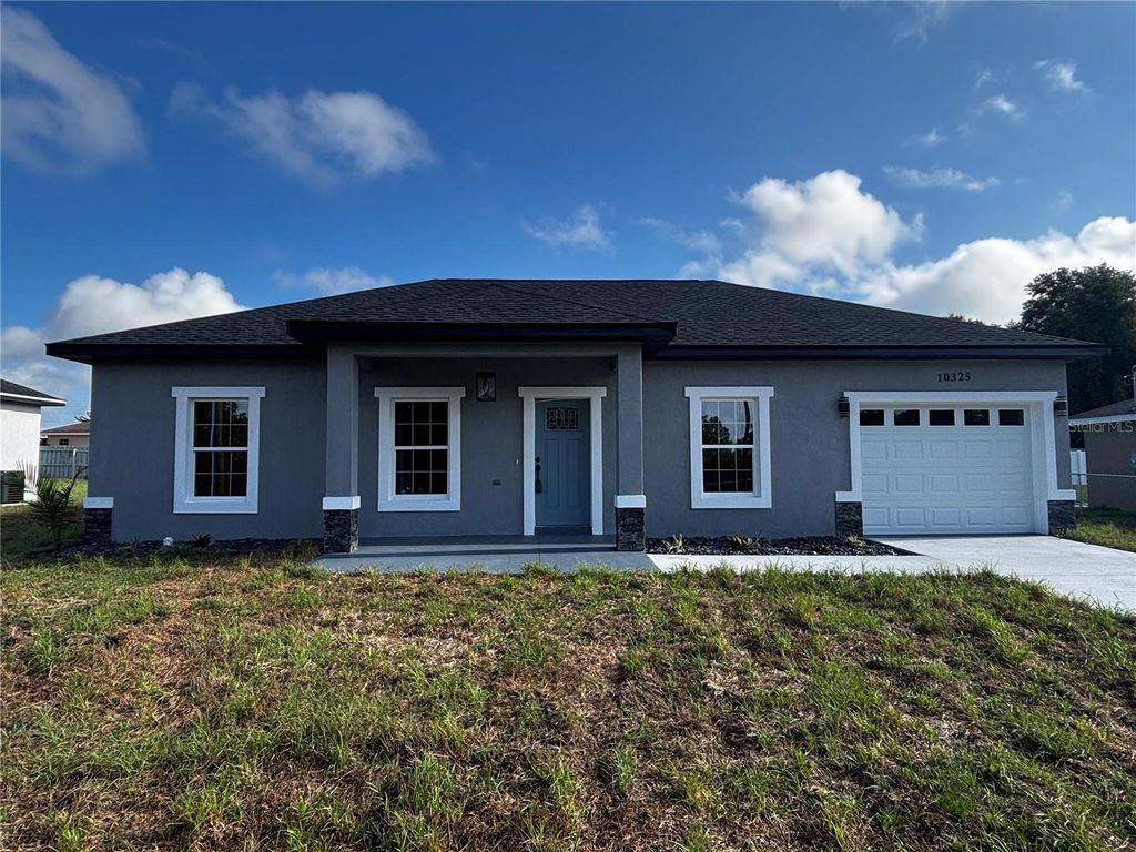 Photo of 10325 SE 125th Lane, Belleview, FL 34420 (MLS # OM724272)