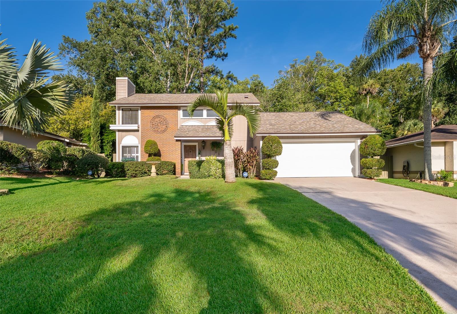 Exceptional two-story home in the sought-after Highlands of Winter Springs, a community surrounded by scenic nature trails and lush green spaces. Located within walking distance to top-rated Seminole County schools, with shopping, dining, and major roadways just minutes away. Situated on a premium conservation lot with no rear neighbors, this 3-bedroom, 2.5-bath residence offers nearly 2,200 sq. ft. of living space. A grand two-story entry leads to an elegant living room with a fireplace accented by an antique Belgium Oak mantle from the 1850s. The updated kitchen opens to the dining area and a spacious family room featuring exposed beams and tongue-and-groove wood ceilings, creating a warm, light-filled atmosphere. The landscaped backyard offers mature trees, fruit-bearing plants, and a storage shed. Recent updates include a newer roof, A/C, and water heater. Low HOA dues include access to Lakeside Park with sports courts, playgrounds, clubhouse, Jr. Olympic saltwater pool, and nature trails. Convenient to Soldier’s Creek Park, Cross Seminole Trail, Central Winds Park, major highways, and Winter Springs Town Center.