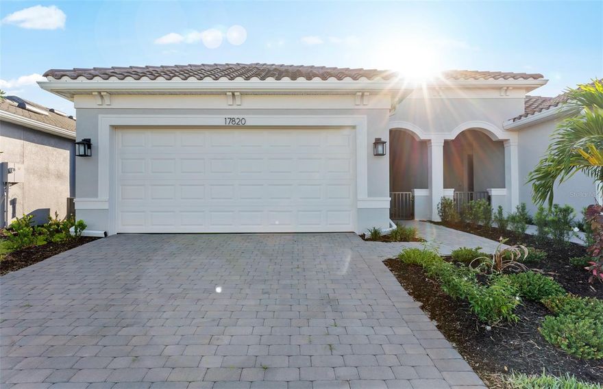 Step into luxury with this spacious Ellenwood Villa, nestled in an exclusive gated community that promises a maintenance-free lifestyle. In this top selling floorplan, elegance meets functionality with an array of high-end features designed for comfort and style. The heart of the home boasts abundant natural light, set against gleaming quartz countertops,  designer backsplash, and pristine stainless-steel appliances, ensuring every culinary endeavor is a delight. Additional pendent lighting prep and recessed lighting throughout allow for well-lit entertaining and activities day or night. The spacious owner's suite with an upgraded tray ceiling detail is a sanctuary, complete with an en-suite bath with a linen closet, separate water closet, walk-in shower and an oversized walk-in closet to house all your essentials. Entertain or unwind in the  covered lanai, and take in the Florida lifestyle with nightly sunset views. The 2-car garage with utility sink offers ample space for vehicles and storage alike. Beyond the exceptional features of the home, the community guarantees peace of mind with its secure gated entrance and the convenience of maintenance-free living. Get to know your new neighbors with private access to the community Pool and Covered Veranda, for residents only.  Don't miss the opportunity to claim this gem as your own. Book a viewing today and experience upscale living at its finest!