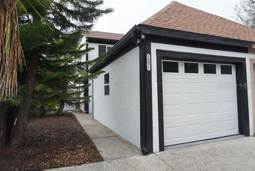 Completely renovated (2023):  Beautifully updated two-story townhome with 2-bedrooms, 2.5 baths and a finished 1-car garage. Includes all new windows/3 sliders, new HVAC & duct work, new roof, new water heater, new kitchen and 3 new baths. Also new carpeting, new interior doors & baseboards, fresh interior & exterior paint.  New blinds included on all sliders and windows. No HOA or CDD fees.  Rare end unit w/private patio & fenced in back yard. Beautiful kitchen updates include shaker cabinets, quartz countertops, tile backsplash, Frigidaire stainless steel appliances, and breakfast bar with seating for 3. The included Coffee bar has trash and recycling pull outs.  Gorgeous bathroom updates include tile floors, tile showers and tub surround. as well as new shaker cabinets, mirrors, lighting and fixtures.  The second floor has a large primary suite with double door entry, new full bath with double sinks and walk in-closet.  The large secondary suite includes new full bath and large closet. The convenient Upstairs laundry includes a dryer and new (2025) washer as well as a large extra closet. First floor includes large 18 x 15 living room with coat closet, and large 14 x 13 secondary family room/dining/den/office along with an updated powder bath.  A One car fully finished garage includes new (2023) flaked epoxy floor coating and motion sensor security light outside. Between the garage and house is an attached shed for extra storage that houses a newer hot water heater.  A wonderful large private patio sits between the garage and house.  Driveway fits 2 vehicles.  Maintenance free yard includes concrete patios and walkways with mulched yard.  Located in sought after Northdale community. Location, location, location means minutes to shopping, restaurants, and sporting events. Seller including a one-year American Home Shield warranty at closing.