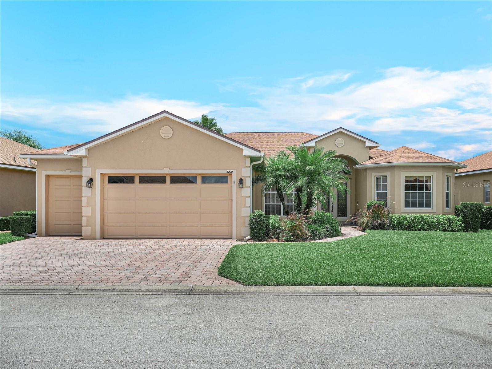 With fabulous WATER VIEWS and GOLF COURSE views, this elegant residence offers a perfect tropical retreat. A large pool with a attached spa invites year-round outdoor enjoyment, framed by the beauty of Lake Ashton's natural surroundings. Ideally situated near Lake Wales and Winter Haven this home offers exceptional access to shopping and entertainment; medical facilities and restaurants. The spacious three-bedroom, two-bath layout includes a large den, ideal for a home office or flexible living space. The chef's kitchen features upgraded 42" cabinets, tiled backsplash, granite counter top and breakfast bar all designed for both form and function. The primary suite offers a spa-like escape with double vanities, a walk-in shower, a large soaking tub, separate water closet, and His and Her walk-in closets. Direct access from the PRIMARY SUITE to the outdoor living space is a BONUS. The outdoor living space is covered and screened to enhance the home's entertaining capabilities, creating a seamless flow between indoor and outdoor living. This ST. JOHN floor plan is a split plan home, which is desirable and spacious. Golf enthusiasts will appreciate the separate golf cart entry garage. Additional home features include: Travertine Flooring in the Living Areas (Bedrooms have carpet), Custom Shelving in the Den/Office with Glass Doors, Tray Ceiling in the Primary and Living Room areas, Sliding Glass Doors that Disappear into a Pocket in the Living Room and Beautiful Window Treatments, Floor outlets in the LR and MORE.... IT'S AS MUST SEE!!! Furniture in the home will convey with the sale of the home. Located in Lake Ashton, a 55+ community, residents enjoy access to a resort-style pool, fitness center, pickleball and tennis courts, and planned activities. Lake Ashton offers 2- 18 hole golf courses (Memberships Optional), Restaurant, Pro Shop and Eagles Nest. If you are seeking luxury, security and an active lifestyle, Lake Ashton could be your next home.