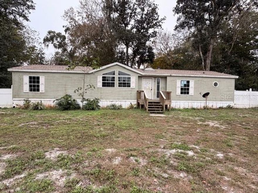 Four bedroom, two full bath manufactured home on .43 fenced lot. Home features two living areas, one can be used to entertain guests and the other can be the main living room. Spacious Primary suite with a sitting room attached. Home is huge! Show and sell!