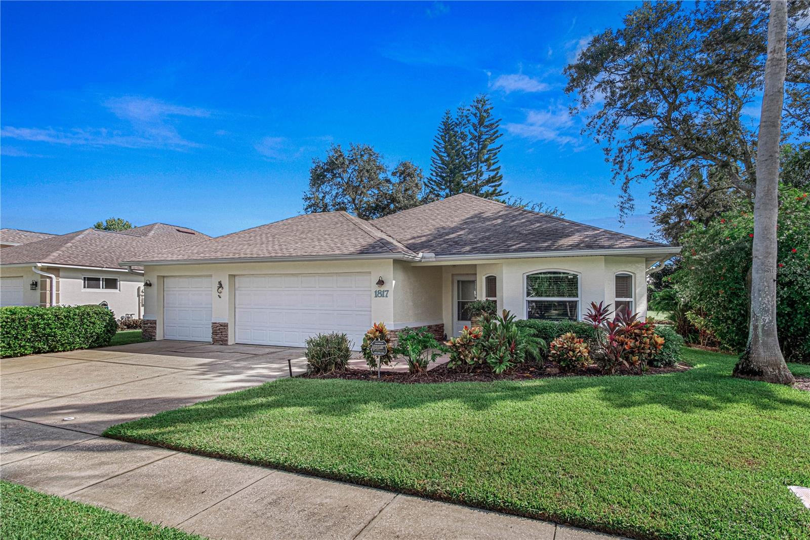 Welcome to Turnbull Bay Country Club Estates! Overlooking a tranquil lake, and the 11th fairway and tee box of The Preserve at Turnbull Bay Golf Club, this beautifully updated 3 bedroom, 2 full bath home has been very tastefully remodeled with all new modern appliances and amenities. Enter the front door and you'll notice the luxury vinyl throughout. To the right is the newly remodeled kitchen with new cabinetry, Quartz countertops with undermount sink, subway tile backsplash, and gas cooktop & stove for the family chef! The kitchen opens up to an extra large Living area with vaulted ceilings and gentle lighting that give a warm, "homey" feel. The Master Suite is located in the rear of the home and features a large walk-in closet and an exquisite bathroom that was completely remodeled in 2025. Two more large bedrooms, a full bath and laundry room complete the living space. A new sliding glass door opens to the screened-in patio with ceiling fan. This East facing view offers amazing sunrises over the lake and golf course while providing shade in the hot afternoon sun. The extra large 3 bay garage has plenty of space for two cars, plus an additional "toy bay" for your golf cart, boat, or motorcycle. A new roof was installed in 2023 along with a whole house generator, guaranteeing you will never be without power! This gem of a home needs absolutely nothing and is move-in ready! Furnishings are not included in sale, but are open for negotiation if interested. The Preserve at Turnbull bay Golf Course is a public course and many membership options are available. Community is golf cart and pet friendly, off the beaten path, yet close to shopping, world-class dining, parks and sports complex, and one the most beautiful drivable white sand beaches in Florida. Your New Smyrna Beach home awaits. Call for a private showing today!