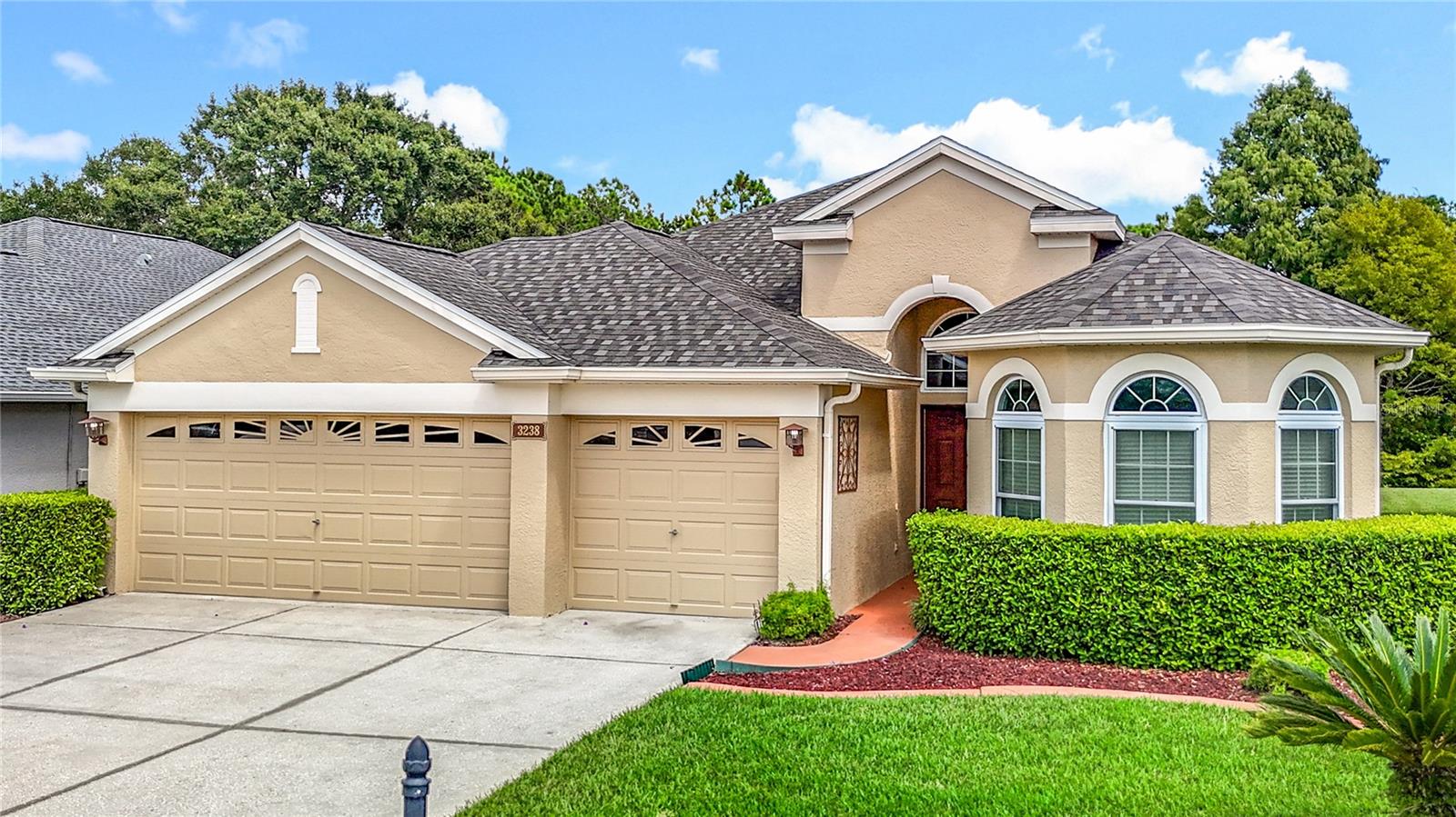 What better way to enjoy your Florida life? This extremely well maintained 3-4 bedroom home in the vibrant Plantation Palms golf course community has so much to offer, and is VALUE PRICED TO SELL. Resting on a quiet cul-de-sac street that reflects pride of ownership, you will love the home’s curb appeal. Step inside to assess the flexible floor plan that offers plenty of options for formal & informal function, and the 3 way split bedroom format allows for private retreat. The sellers have invested in this home in order for the new owners to focus on their desired personal touch. Recent functional upgrades include ROOF, AC, WATER HEATER, WINDOWS, exterior paint and luxury vinyl flooring. Contemporary features include a gourmet kitchen with breakfast bar open to the family room, as well as upgraded bathrooms. Step out back to enjoy peaceful views on your oversized pavered lanai. You are sure to appreciate the parklike setting with a peek towards the 11th tee with a tree-lined buffer between you and the fairway. Then, of course, there is the oversized 3 car garage. Perfect for the golf cart. The community and geographic area are also a main draw for this property. You will appreciate how “walkable” and “bikeable” the surrounding areas are, both for pleasure or purpose. The GATED community of Plantation Palms itself is a very peaceful but active community. Walk a short block to enjoy a meal or a beverage on the veranda at Mulligans Restaurant overlooking the 18 HOLE GOLF COURSE. When company arrives. join in on trivia night at Mulligans or partake in a fun round of miniature golf. All of this with NO ADDITIONAL CDD TAX and LOW HOA FEES. The neighborhood is located so centric to most everything you will need on a regular basis. The impressive Pasco County recreation center and library are a half mile walk or bike ride. The rec center not only includes multiple ball diamonds and soccer fields, but an Olympic style pool, outdoor AND indoor basketball courts, skateboard course and tennis courts. The public elementary school and multiple private schools, preschool and daycare options are within a mile. The supermarket is about a short 1.5 mile drive. All of this is accessible without having to access a highway. Centrally located for your commute as well. Easy access to main arteries such as SRs 54 & 56, I75/275, SR41. Less than an hour to urban Tampa, Tampa International Airport, the beaches or the beautiful Nature Coast of The Gulf.