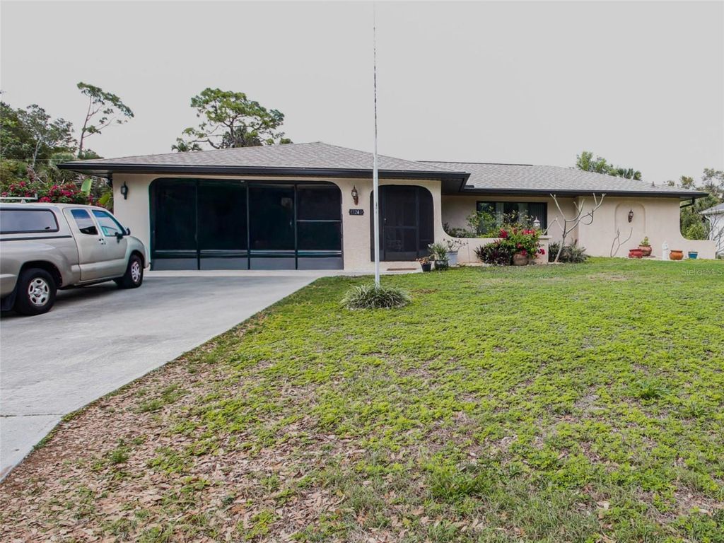 Photo of 15248 Community Avenue, Port Charlotte, FL 33953 (MLS # TB8492300)
