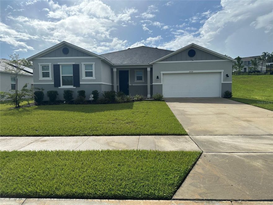 Don’t miss the opportunity to own this stunning 3-bedroom, 2-bath home and a large flex room with beautiful French doors, packed with features and upgrades designed for family comfort and convenience. The spacious modern-style kitchen is a chef's dream, boasting elegant stone countertops, a large sink, a garbage disposal, a hand detection faucet, stainless steel whirlpool appliances, a wall oven with smart home compatibility, and soft-close cabinets. The inviting entryway and foyer set the stage for warm welcomes for your guests. Individual laundry room with large sink, and matching front load washer and dryer, plus additional storage and organization cabinets in the laundry room. The master suite offers a luxurious retreat with a generously sized bathroom and a large walk-in closet, perfect for unwinding after a busy day. Additional storage is plentiful with multiple linen and storage closets throughout the home, and each guest bedroom includes its spacious walk-in closet. The home is covered in beautiful tile throughout with no carpet in sight. The expansive living area provides ample space for entertaining family and friends. This home is equipped with modern upgrades, including a state-of-the-art HVAC system with a UV light feature that purifies the air and reduces the spread of viruses and bacteria. For added peace of mind, there is a comprehensive security system with cameras, and motion detectors wired so that can be activated through any company and extra lighting. Located in a serene part of the community, you can enjoy peaceful morning walks or take advantage of the nearby playground for family fun. Conveniently close to shopping, and dining, and less than an hour from thrilling theme parks, a short drive to downtown Clermont, biking trails, disc golf, and even local breweries, Lake Ridge Winery and Vineyard is within a short drive. This home offers a perfect balance of relaxation and excitement.