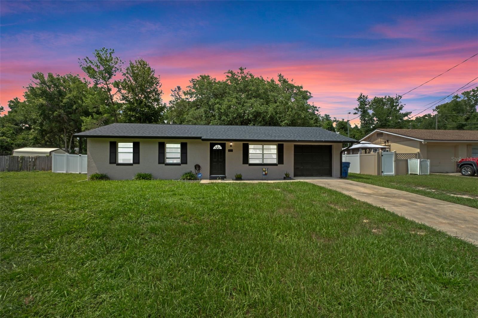 Welcome to this charming and well-maintained 3-bedroom, 1.5-bath traditional home located in the desirable southwest
side of Orange City. Freshly painted and filled with natural light, the home features an updated kitchen with ample
cabinet space and direct access to a spacious concrete patio—perfect for outdoor entertaining. Most of the home
features durable tile flooring, and the primary bedroom includes a convenient half bath. The one-car garage offers
added functionality with a washer, dryer, utility sink, and window.
Enjoy a fully fenced backyard with mature shade trees, ideal for pets or relaxing in privacy. Major updates include a new
roof (2022), updated electrical panel (2019), and privacy fence (2020). Conveniently located just minutes from schools,
shopping, I-4, the SunRail, and Blue Springs State Park, with the beaches only 30 minutes away and Orlando within a
45-minute drive. This is the perfect starter home or downsizing opportunity—schedule your private showing today!