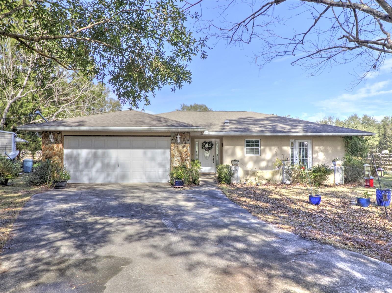 Beautiful 14.16-acre horse farm on Hwy 475A, very close to the Florida Horse Park and the Greenway and a short drive from the World Equestrian Center. Farm is fenced and cross fenced, with water to the lush pastures. 1 Arena, 3 pastures, 3 paddocks and 2 pole barns, one has 2 stalls with electric and water and the other has 5 stalls with water and is 60X30. There are two residences on the property. The main home has a split open floorplan. The kitchen features all stainless-steel appliances, solid wood cabinets, granite counters, and a tile backsplash. The kitchen opens up to the large dining room / living room combo overlooking the wonderful screened in pool area. The multi panel sliding glass doors open up to allow the screened-in pool area to extend from the living room, great for entertaining. There is a covered porch that over-looks the pool and the back paddock. Off the pool deck is access to one of the 3 full bathrooms! The home features 2 HVAC systems. Also on the property is a 2004 3/1 mobile home perfect for an income property with 924 sqft. This acreage is designated Employment Activity Center/Equine Commercial Support District by Future Land Use Map designation and can be used for commercial, manufacturing, multi-unit residential (up to 22 units/acre), and various other uses.