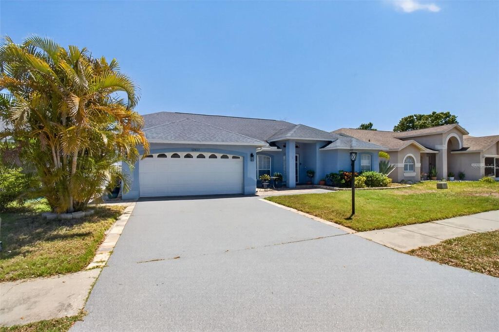 Photo of 12611 Pineforest Way E, Largo, FL 33773 (MLS # TB8511943)